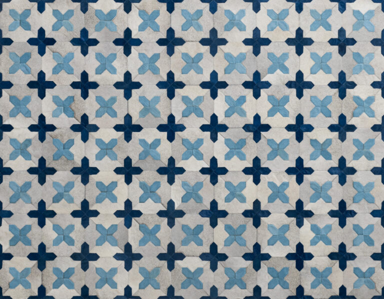 custom patchwork cowhide rug in off white and dyed dark blue and light blue colors