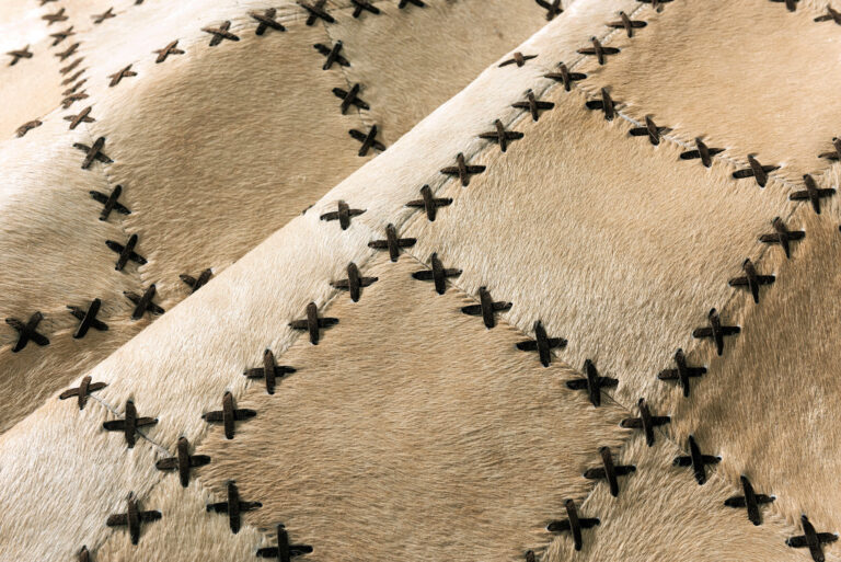 Tiento Cowhide Patchwork Rug in Large Patches with Tiento finishes